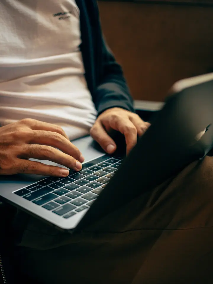 Closeup of Person Typing on Laptop | Salt Lake City Apartment