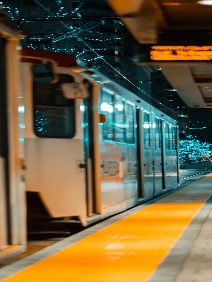 Train pulling into station nighttime | Salt Lake City Apartments